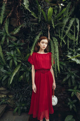 Pleated silk midi dress with soft sheer overlay and gathered waistline for elegant movement